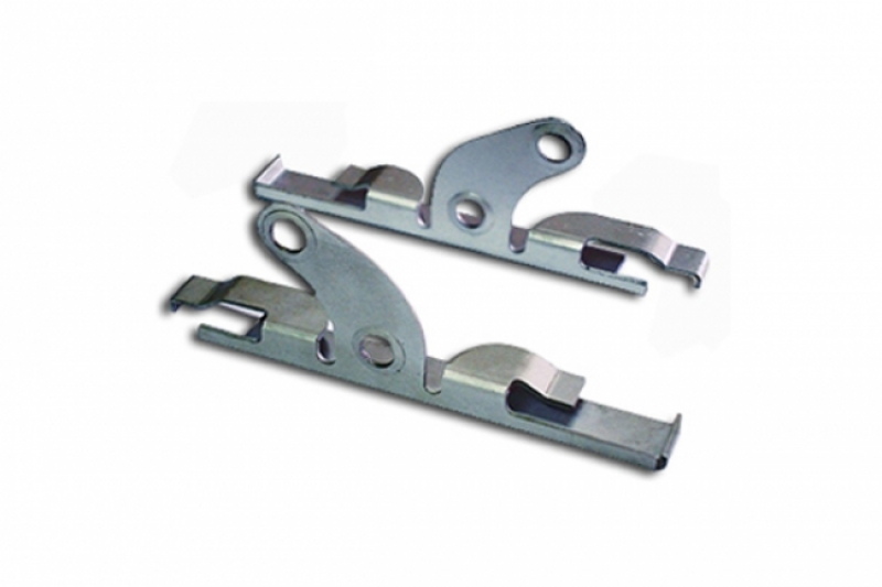 Automotive door latch striker plates